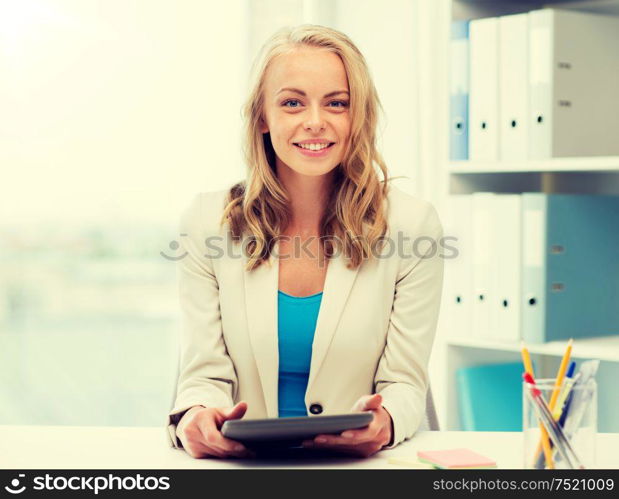 office, business, education, technology and people concept - smiling businesswoman or student with tablet pc computer sitting at table. businesswoman or student with tablet pc at office