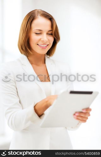 office, business, technology and internet concept - businesswoman with tablet pc in office