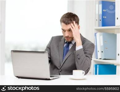 office, business, technology and internet concept - busy businessman with laptop computer and coffee at office