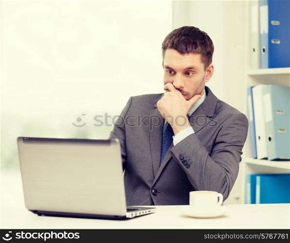 office, business, technology and internet concept - busy businessman with laptop computer and coffee at office