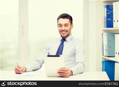 office, business, technology, finances and internet concept - smiling businessman with tablet pc computer and documents at office