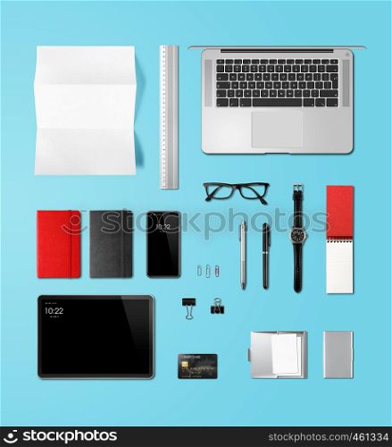 Office desk branding mockup top view isolated on blue. Blank space. Office desk branding mockup top view isolated on blue