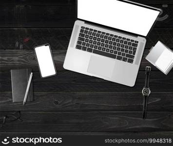 Office desk mockup top view isolated on black wooden background. Office desk mockup isolated on black wooden background