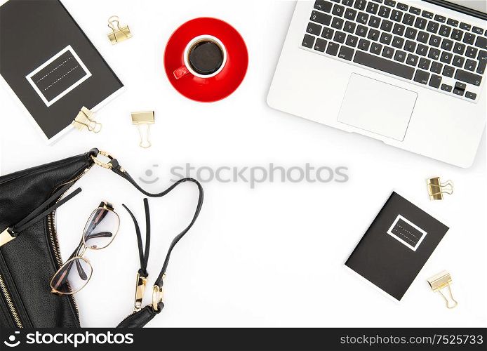 Office desk. Notebook, coffee and feminine accessories on white background. Fashion flat lay for blogger social media