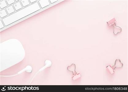 Office desk table top view with office supply, pink table with copy space, pink color workplace composition, flat lay