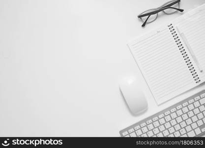 Office desk table top view with office supply, white table with copy space, White color workplace composition, flat lay