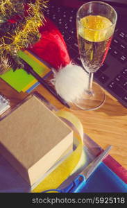 office desk with christmas accessories, wrapping paper for presents and stationery, view from above