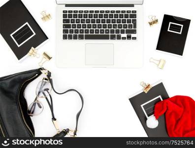 Office desk with Christmas decoration on white background. Fashion flat lay for social media