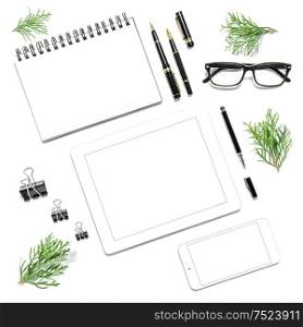 Office desk with digital gadgets and Christmas decoration on white background. Minimalistic flat lay