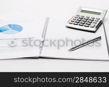 Office desk with supplies business silver pen on open notepad