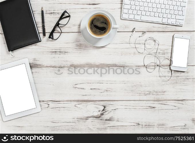 Office desk with tablet pc, mobile, cup of coffee. Business background with space for your text image picture. Flat lay