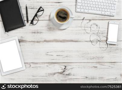 Office desk with tablet pc, mobile, cup of coffee. Business background with space for your text image picture. Flat lay