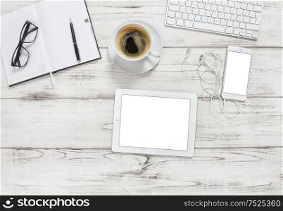 Office desk with tablet pc, notebook, cup of coffee. Business background with space for your image. Flat lay