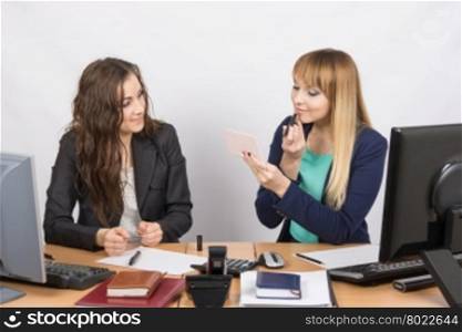 Office employee observes as lipstick colleague sitting beside his desk