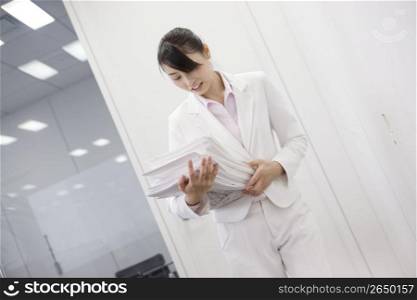 Office lady holding many documents