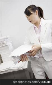Office lady putting documents in order