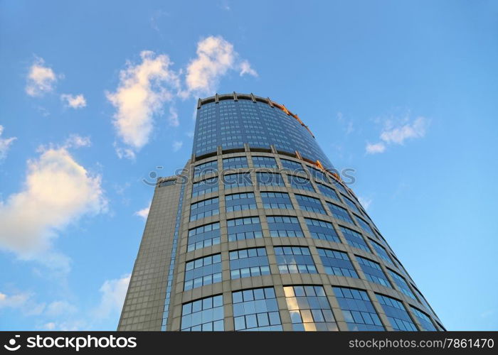 Office modern building against the evening sky with white clouds, Moscow, Russia