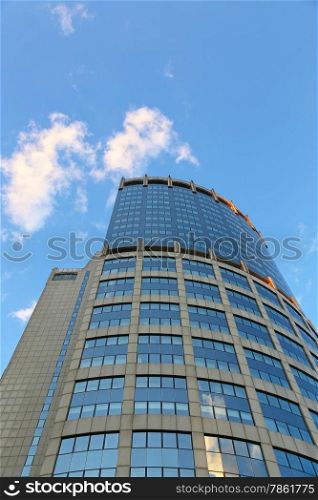 Office modern building against the evening sky with white clouds, Moscow, Russia