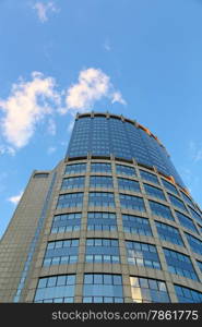 Office modern building against the evening sky with white clouds, Moscow, Russia