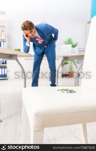 Office prank with sharp thumbtacks on chair