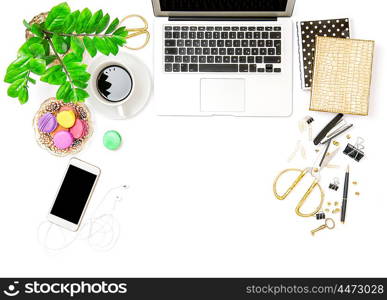 Office supplies and laptop. Business still life. Coffee and macaroon cookies. Creative workplace. Flat lay