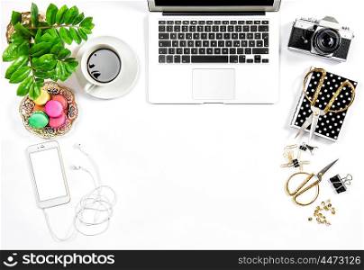 Office supplies and laptop. Business still life. Coffee and macaroon cookies. Flat lay