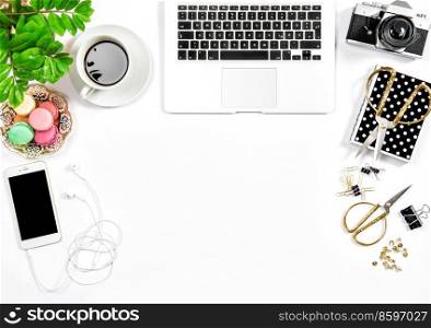Office supplies and laptop. Feminine flat lay. Coffee and macaroon cookies