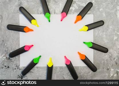 Office supplies, empty paper sheet and colorful markers on the table in stationery store, nobody. Assortment in shop, accessories for drawing and writing, school equipment