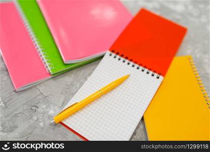 Office supplies, notebook and a pencil on the table in stationery store, nobody. Assortment in shop, accessories for modeling, school equipment