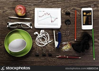 Office table. Office workplace with tablet cup mobile phone and stationary