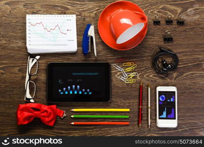 Office table. Office workplace with tablet cup mobile phone and stationary