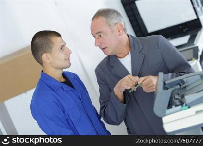 office technicians having a conversation