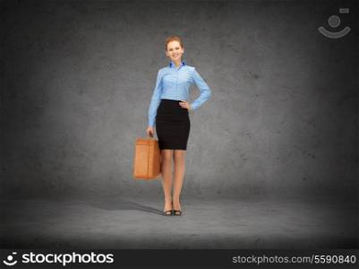 office, travel and business concept - smiling businesswoman with suitcase