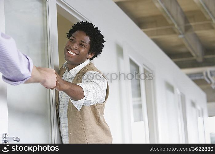 Office Worker Greeting Colleague