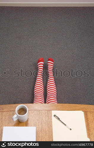 Office worker hiding under desk