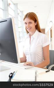 Office worker in front of desktop computer