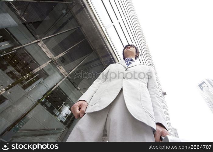 Office worker in front of the building