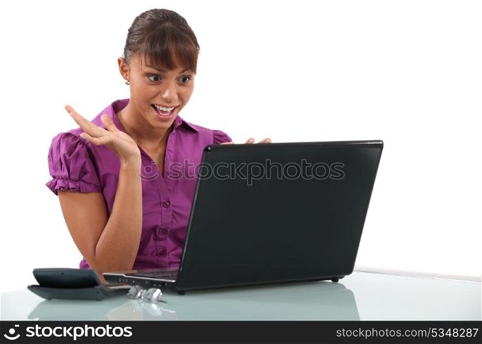Office worker looking at laptop