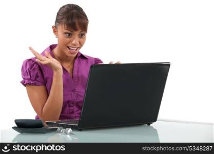 Office worker looking at laptop