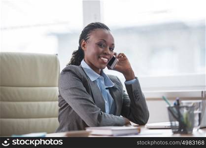 Office worker making a phone call understanding the importance of positive attitude