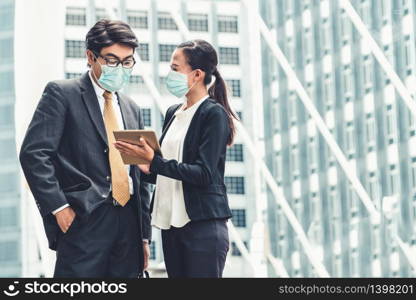 Office worker meeting with face mask quarantine from coronavirus or COVID-19. Concept of protective working environment to reopen business and stop spreading of coronavirus or COVID-19.