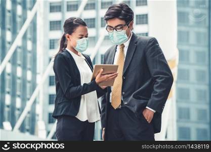 Office worker meeting with face mask quarantine from coronavirus or COVID-19. Concept of protective working environment to reopen business and stop spreading of coronavirus or COVID-19.