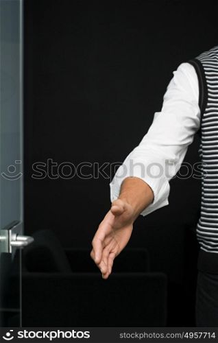 Office worker offering handshake