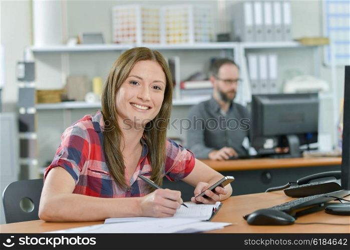 Office worker reading a text message