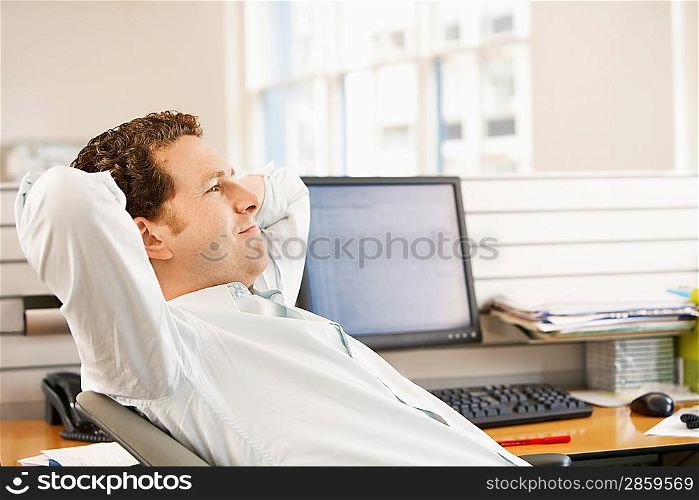 Office Worker Reclining at his Desk