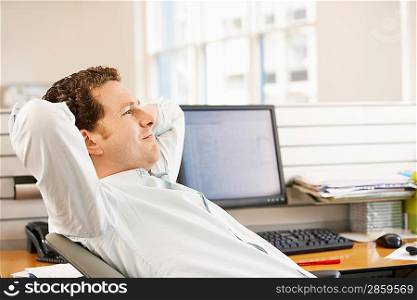 Office Worker Reclining at his Desk