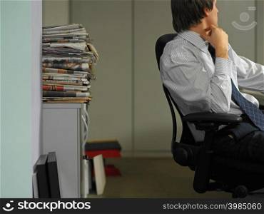 Office worker scratching his neck
