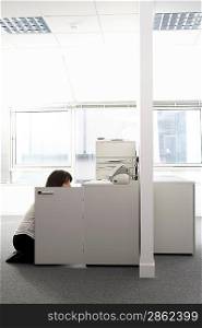 Office Worker Searching Cupboard