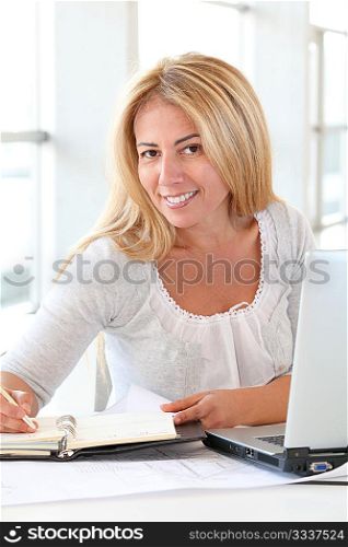 Office worker sitting at her desk