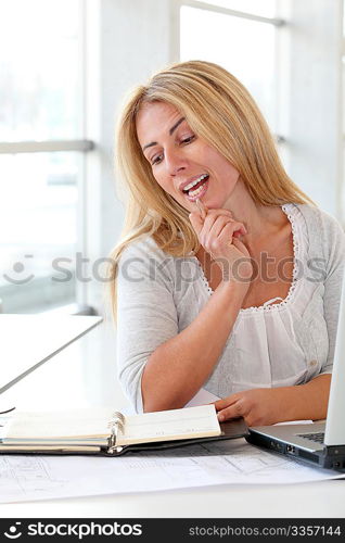 Office worker sitting at her desk